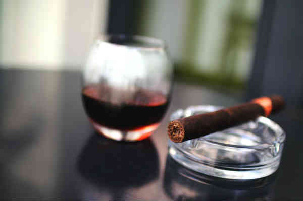 a smoking ritual - burbon and a cigar