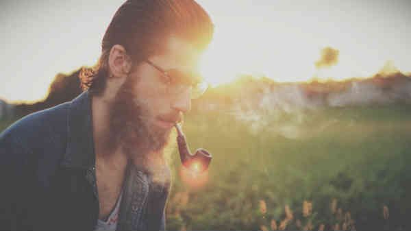 hipster smoking a pipe