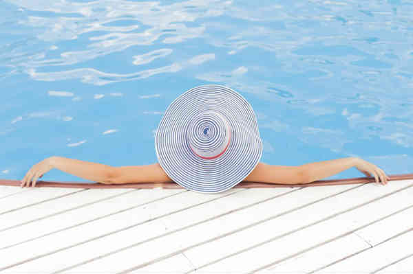 woman relaxed by the pool